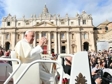 Pope Francis greets the crowd at the end of a Mass for the opening of the 16th Ordinary General Assembly of the Synod of Bishops, Wednesday, Oct. 2, 2024, in St Peter's Square.