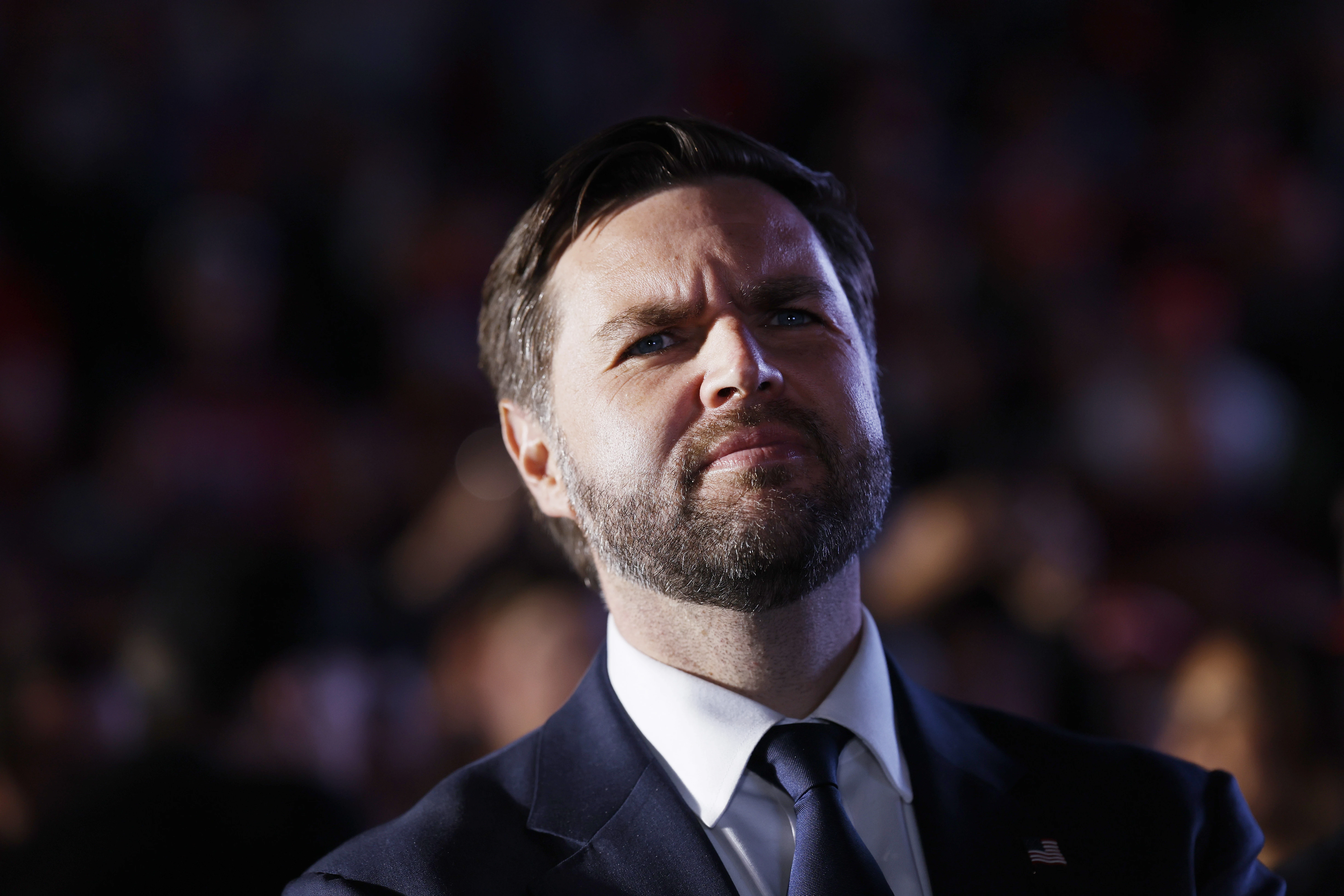 Republican vice presidential candidate Sen. JD Vance listens as Republican presidential nominee former president Donald Trump speaks at a campaign rally at the Butler Farm Show fairgrounds on Oct. 5, 2024, in Butler, Pennsylvania.?w=200&h=150