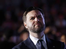 Republican vice presidential candidate Sen. JD Vance listens as Republican presidential nominee former president Donald Trump speaks at a campaign rally at the Butler Farm Show fairgrounds on Oct. 5, 2024, in Butler, Pennsylvania.