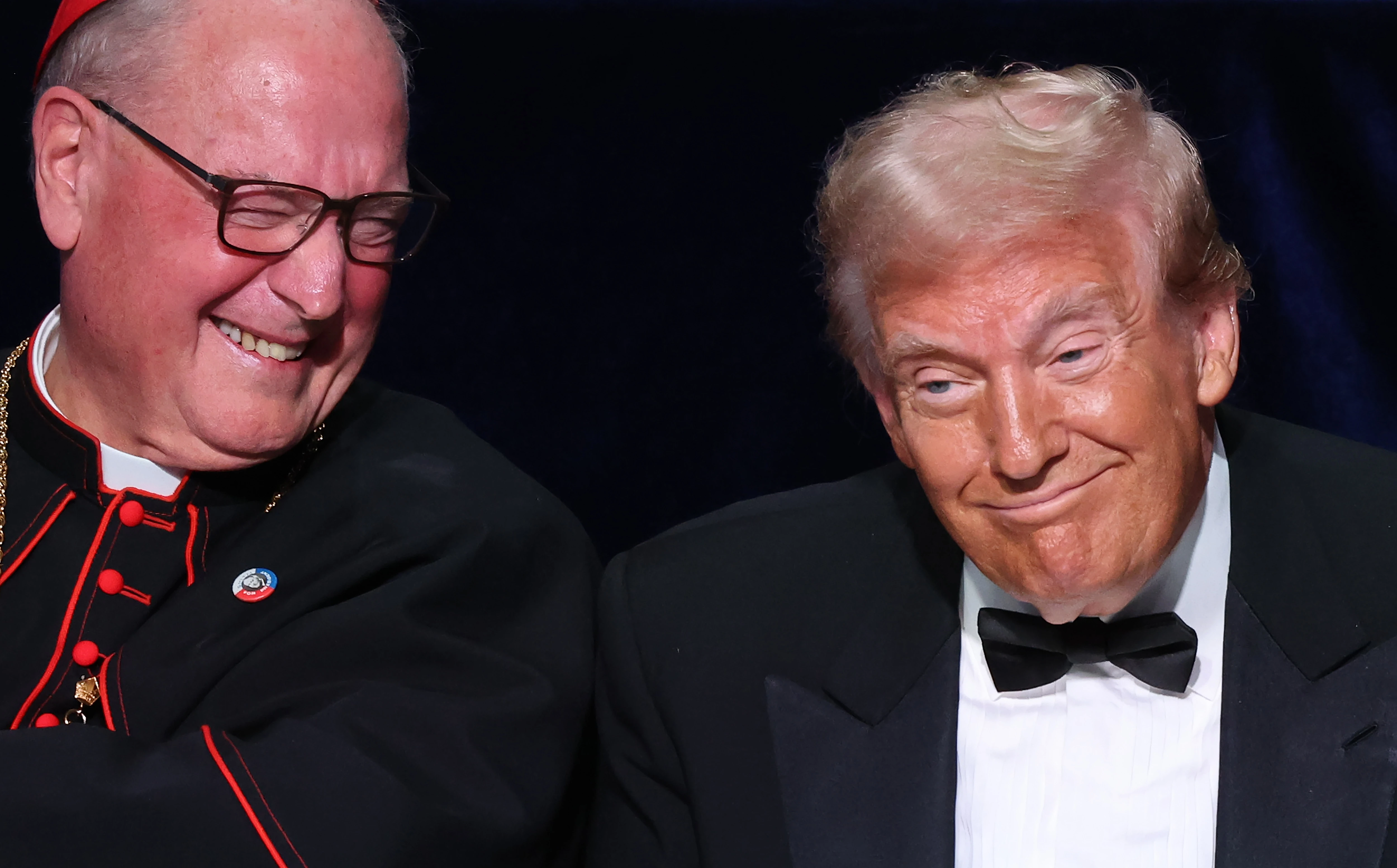 Cardinal Timothy Dolan (left) and Republican presidential nominee former president Donald Trump react during the annual Alfred E. Smith Foundation Dinner at the New York Hilton Midtown on Oct. 17, 2024, in New York City.?w=200&h=150