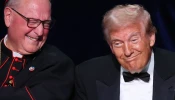 Cardinal Timothy Dolan (left) and Republican presidential nominee former president Donald Trump react during the annual Alfred E. Smith Foundation Dinner at the New York Hilton Midtown on Oct. 17, 2024, in New York City.