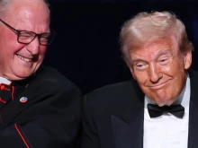 Cardinal Timothy Dolan (left) and Republican presidential nominee former president Donald Trump react during the annual Alfred E. Smith Foundation Dinner at the New York Hilton Midtown on Oct. 17, 2024, in New York City.