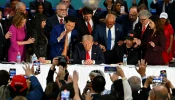 Former president and Republican presidential candidate Donald Trump prays during a roundtable discussion with Latino community leaders at Trump National Doral Miami resort in Miami on Oct. 22, 2024.