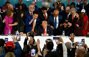 Former president and Republican presidential candidate Donald Trump prays during a roundtable discussion with Latino community leaders at Trump National Doral Miami resort in Miami on Oct. 22, 2024. Credit: CHANDAN KHANNA/AFP via Getty Images