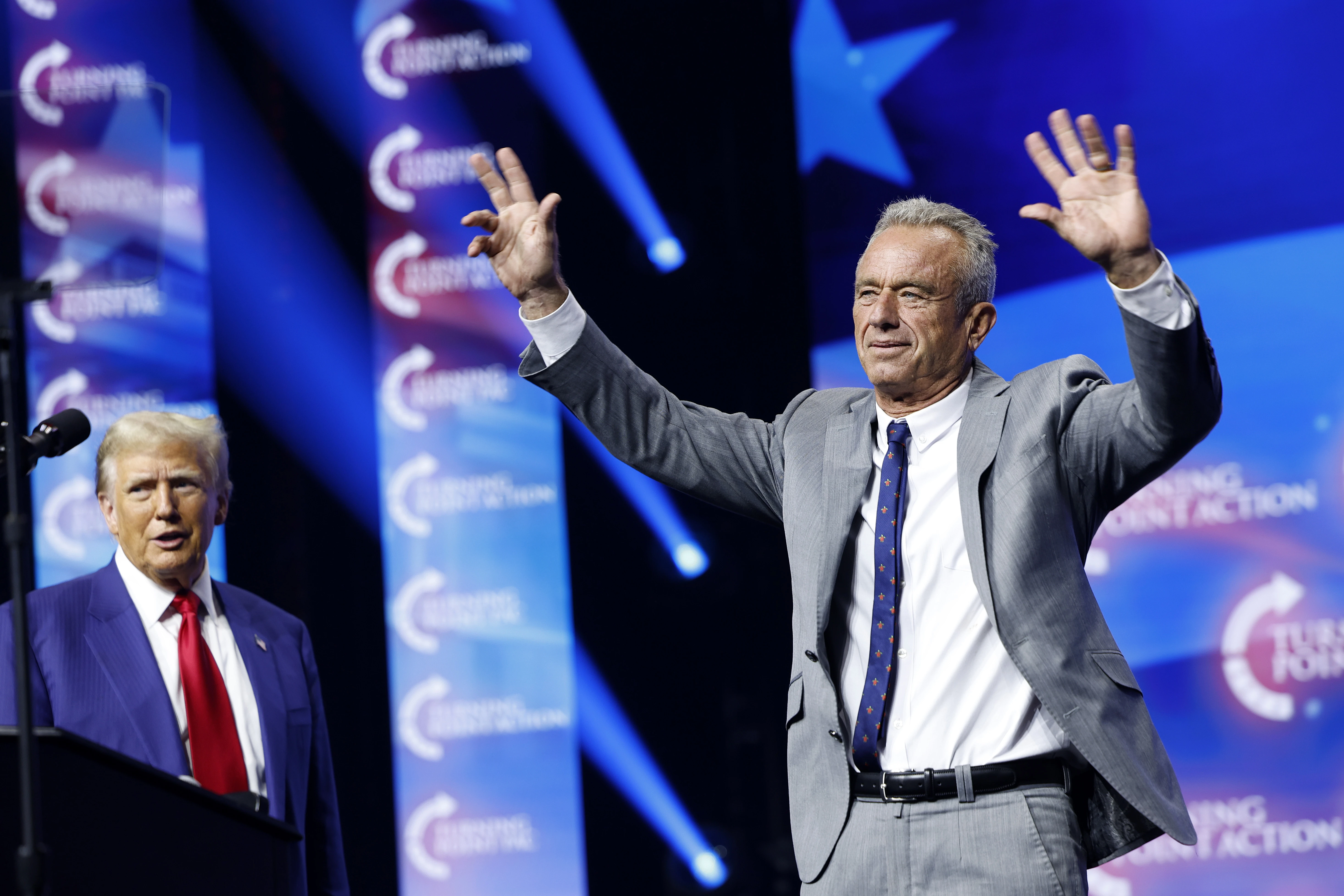 Republican presidential nominee and former president Donald Trump welcomes Robert F. Kennedy Jr. to the stage at a Turning Point Action campaign rally at the Gas South Arena on Oct. 23, 2024, in Duluth, Georgia.?w=200&h=150