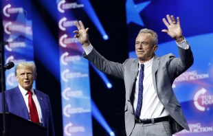 Republican presidential nominee and former president Donald Trump welcomes Robert F. Kennedy Jr. to the stage at a Turning Point Action campaign rally at the Gas South Arena on Oct. 23, 2024, in Duluth, Georgia. Credit: Anna Moneymaker/Getty Images