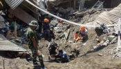 Members of a rescue team search for victims at Klatanlo village in East Flores Regency, East Nusa Tenggara, on Nov. 4, 2024, after Mount Lewotobi Laki-Laki erupted overnight.