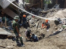 Members of a rescue team search for victims at Klatanlo village in East Flores Regency, East Nusa Tenggara, on Nov. 4, 2024, after Mount Lewotobi Laki-Laki erupted overnight.