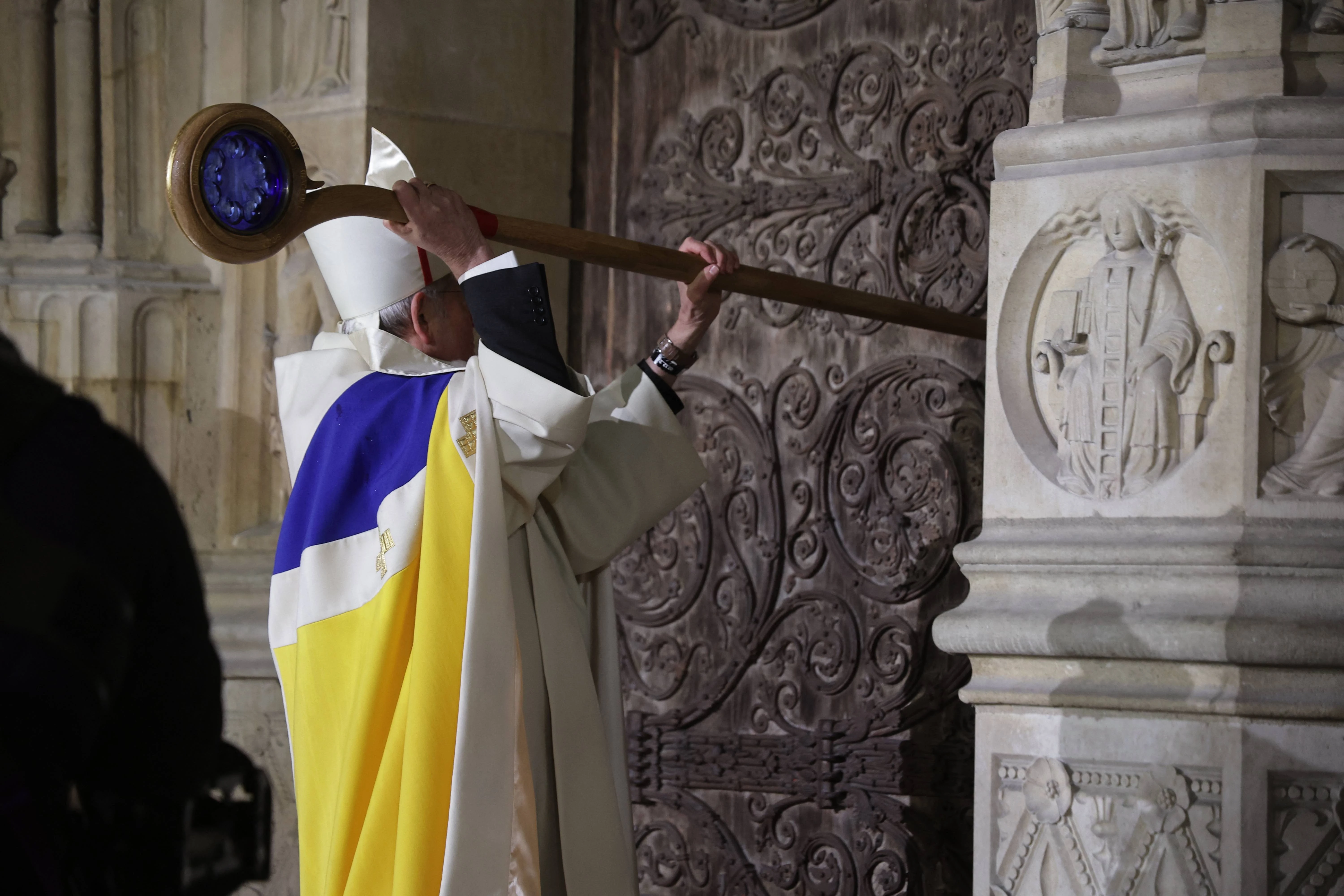 Archbishop of Paris Laurent Ulrich knocks on the door of Notre-Dame Cathedral during a ceremony to mark the reopening of the landmark cathedral in central Paris on Dec. 7, 2024.?w=200&h=150