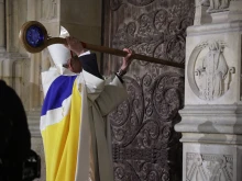 Archbishop of Paris Laurent Ulrich knocks on the door of Notre-Dame Cathedral during a ceremony to mark the reopening of the landmark cathedral in central Paris on Dec. 7, 2024.