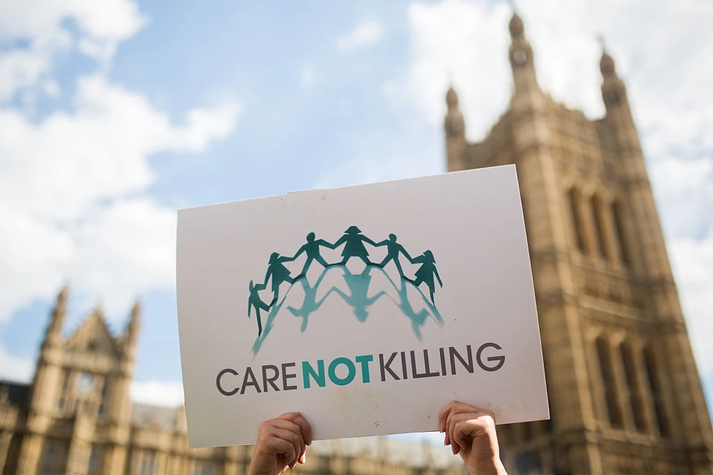 Campaigners against assisted dying gather outside the Houses of Parliament ahead of a House of Commons vote that rejected the legislation on Sept., 11, 2015, in London. Members of Parliament have voted 330 to 118 against a bill that would have allowed doctors to help some terminally ill people end their lives. Campaigners from both sides of the debate gathered outside Parliament, holding placards and voicing their opinions ahead of the first House of Commons vote on assisted dying for 20 years.?w=200&h=150