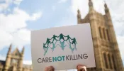 Campaigners against assisted dying gather outside the Houses of Parliament ahead of a House of Commons vote that rejected the legislation on Sept., 11, 2015, in London. Members of Parliament have voted 330 to 118 against a bill that would have allowed doctors to help some terminally ill people end their lives. Campaigners from both sides of the debate gathered outside Parliament, holding placards and voicing their opinions ahead of the first House of Commons vote on assisted dying for 20 years.