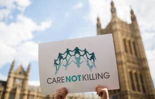 Campaigners against assisted dying gather outside the Houses of Parliament ahead of a House of Commons vote that rejected the legislation on Sept., 11, 2015, in London. Members of Parliament have voted 330 to 118 against a bill that would have allowed doctors to help some terminally ill people end their lives. Campaigners from both sides of the debate gathered outside Parliament, holding placards and voicing their opinions ahead of the first House of Commons vote on assisted dying for 20 years. Credit: Rob Stothard/Getty Images