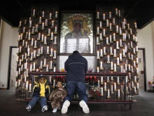 A man prays at the Candlelight Chapel at the National Shrine to Czestochowa in Doylestown, Pennsylvania, on April 2, 2005, the day Pope John Paul II died.