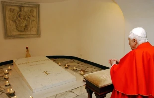 Pope Benedict XVI visits the tomb of the late Pope John Paul II in the grotto beneath St. Peter's Basilica after a meeting with young Catholics, in preparation of the XXI World Youth Day at the Vatican April 6, 2006. Photo by ARTURO MARI/AFP via Getty Images