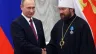 Russian President Vladimir Putin shakes hands with Russian Orthodox Church Bishop Hilarion Alfeyev during a state  ceremony at the Kremlin in Moscow, Russia, on September 22, 2016.
