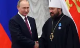 Russian President Vladimir Putin shakes hands with Russian Orthodox Church Bishop Hilarion Alfeyev during a state  ceremony at the Kremlin in Moscow, Russia, on September 22, 2016.