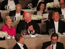 Cardinal Timothy Dolan sits between Hillary Clinton and Donald Trump at the annual Alfred E. Smith Memorial Foundation Dinner at the Waldorf Astoria on Oct. 20, 2016, in New York City.