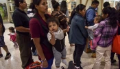 After receiving assistance from the Catholic Charities RGV Humanitarian Respite Center, migrant families from Mexico and Central America who have been granted asylum in the United States are processed for their transport to various destinations across the United States from the at the Central Station Bus Terminal on June 19, 2018, in McAllen, Texas.