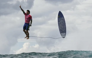 Surfer Gabriel Medina, bronze medalist at the Paris 2024 Olympic Games in Tahiti, shared this photograph on his Instagram with the biblical quote “I can do all things through Christ who strengthens me.” Credit: Jerome BrouilletAFP via Getty Images