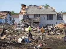 Residents continue recovery and cleanup efforts on May 23, 2024, with the help of family and friends following Tuesday’s destructive tornado in Greenfield, Iowa. The storm was responsible for several deaths in the small community.