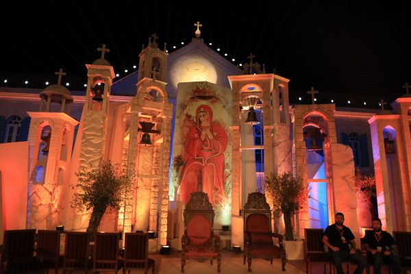 A representation of the image of Our Lady in the Qannubine Monastery, which is a fresco of the Assumption of Mary, was displayed behind the altar set up for the beatification celebration of Patriarch Estephan Douaihy of the Maronite Catholic Patriarchate of Antioch, Lebanon, on Aug 2, 2024. Credit: Marwan Semaan/ACI MENA