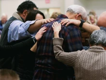 Participants are led through a prayer for those wanting to receive healing during a healing service led by Father Mathias Thelen of Encounter Ministries at St. Patrick Catholic Church in Brighton, Michigan, on Dec. 6, 2024.