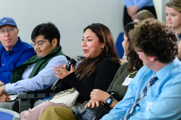 A member of the audience asks a question during a panel discussion exploring the impact of U.S. Latinos on the 2024 election hosted by Georgetown University's Initiative on Catholic Social Thought and Public Life on Monday, Oct. 7, 2024. Credit: Georgetown University/Art Pittman