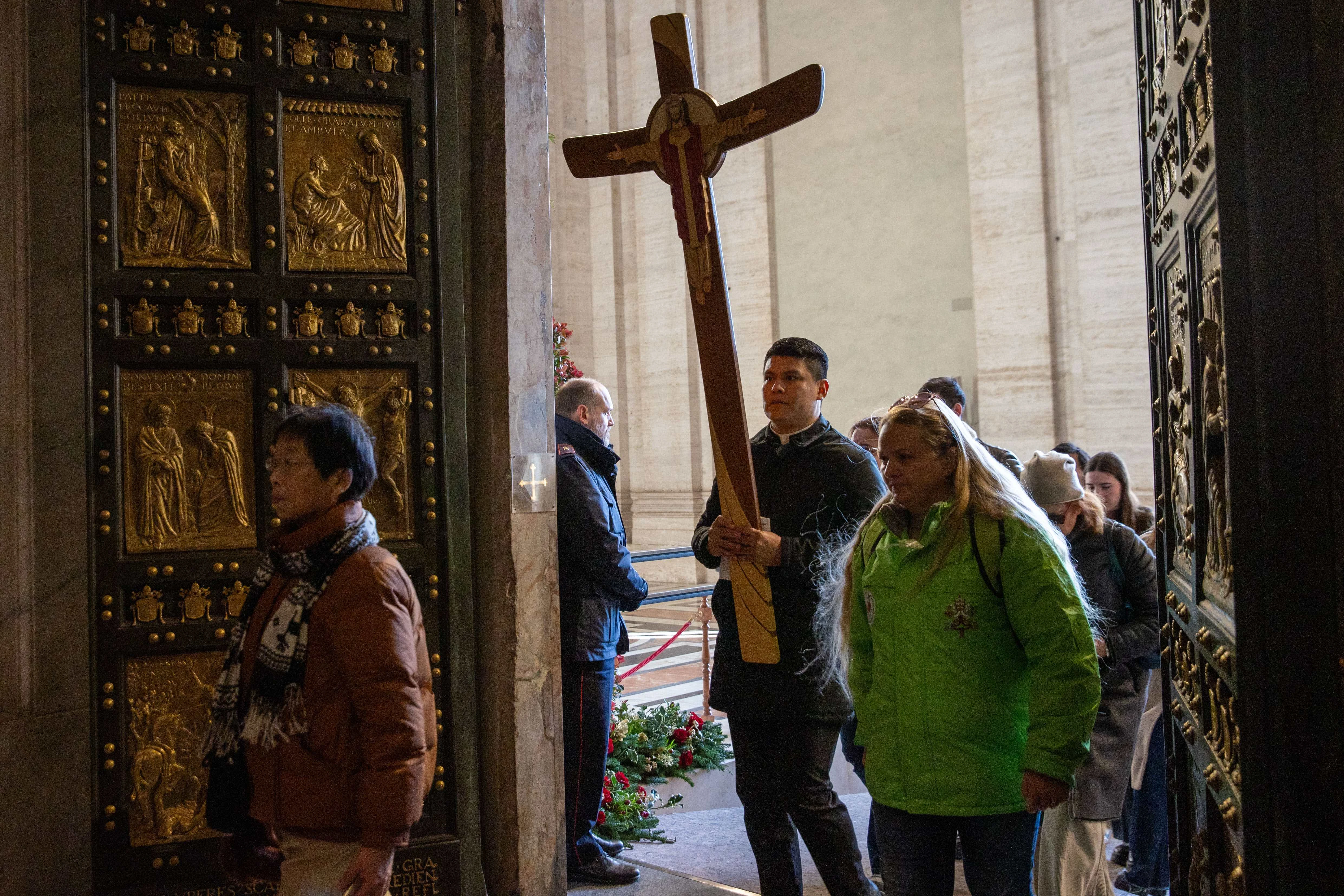 Pilgrims pass through Holy Door of St. Peter’s Basilica