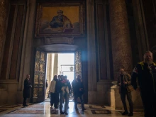 Pilgrims cross the Holy Door of St. Peter’s Basilica in the Vatican on Dec. 25, 2024.