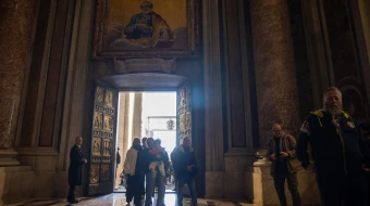 Pilgrims cross the Holy Door of St. Peter’s Basilica in the Vatican on Dec. 25, 2024.