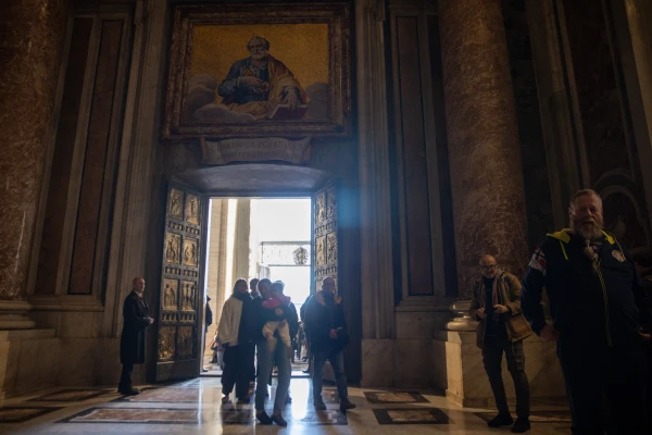 Pilgrims cross the Holy Door of St. Peter’s Basilica in the Vatican on Dec. 25, 2024. Credit: Daniel Ibáñez/EWTN News