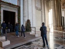 Pilgrims cross the Holy Door of St. Peter’s Basilica in the Vatican on Dec. 25, 2024.