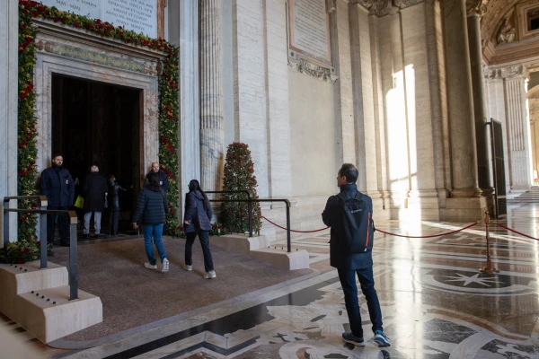 Pilgrims cross the Holy Door of St. Peter’s Basilica in the Vatican on Dec. 25, 2024. Credit: Daniel Ibáñez/EWTN News