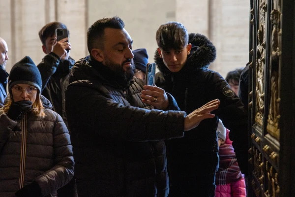 Pilgrims cross the Holy Door of St. Peter’s Basilica in the Vatican on Dec. 25, 2024. Credit: Daniel Ibañez/EWTN News