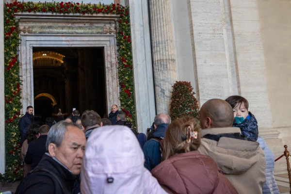 Pilgrims cross the Holy Door of St. Peter's Basilica in the Vatican on December 25, 2024. Credit: Daniel Ibañez/EWTN News