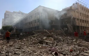 Palestinians stand on the rubble and debris of the Latin Patriarchate Holy Family School after it was hit during an alleged Israeli military bombardment in Gaza City on July 7, 2024, amid the ongoing conflict in the Palestinian territory between Israel and Hamas. Credit: OMAR AL-QATTAA/AFP via Getty Images