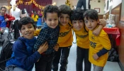 Children of Afghan immigrants to St. Louis play during a holiday party on Dec. 9, 2023.