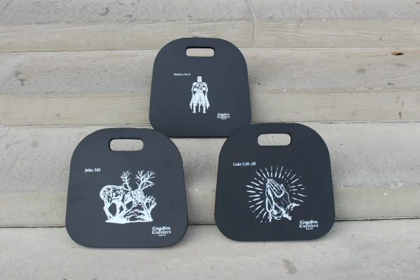 Kingdom Kneelers sell for $19.99 online and feature three designs: A ram caught in a thicket, hands in a prayer posture wrapped in a rosary, and a Crusader. Noah Mullins and Daniel Turek wanted the designs to be specifically Catholic while avoiding designs upon which it would be disrespectful to kneel. Credit: Photo courtesy of Kingdom Kneelers