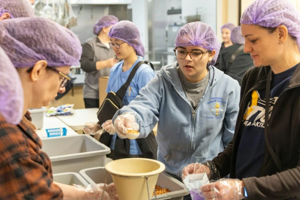 High school students from nearby schools such as Dakota High School and Austin Catholic High School were among hundreds of volunteers who joined the effort on a Saturday morning. Credit: Steven Stechschulte/Special to Detroit Catholic