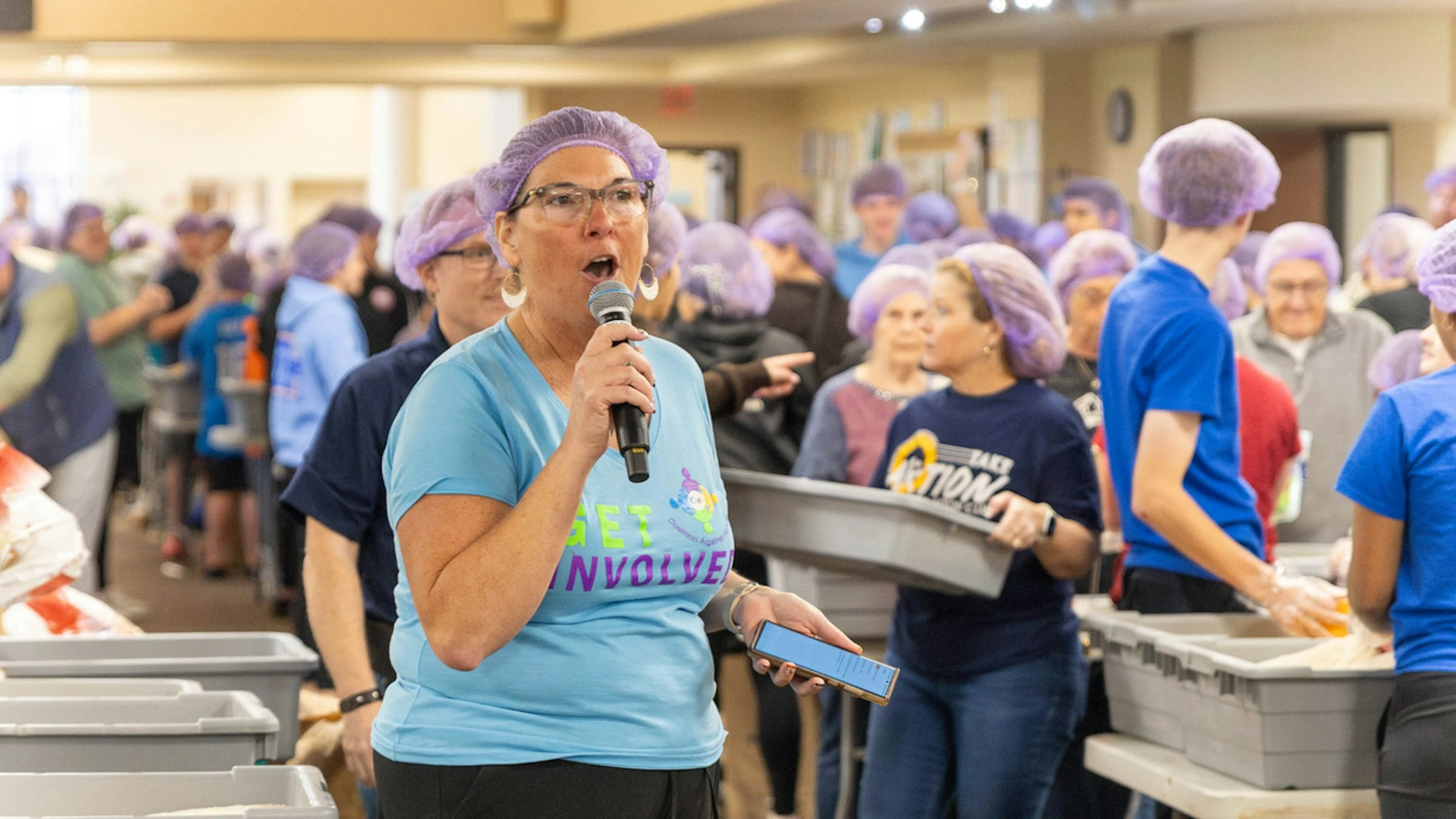 Lori Stillwell, a volunteer and a member of the local Kiwanis Club, directs nearly 600 volunteers who gathered Nov. 2, 2024, at St. Isidore Parish in Macomb, Michigan, to package 100,000 meals in partnership with the Kids Coalition Against Hunger. The massive annual effort brought together volunteers from the Disciples Unleashed Family of Parishes as well as the local community to aid victims of natural disasters, including the recent hurricanes in the U.S. South.?w=200&h=150