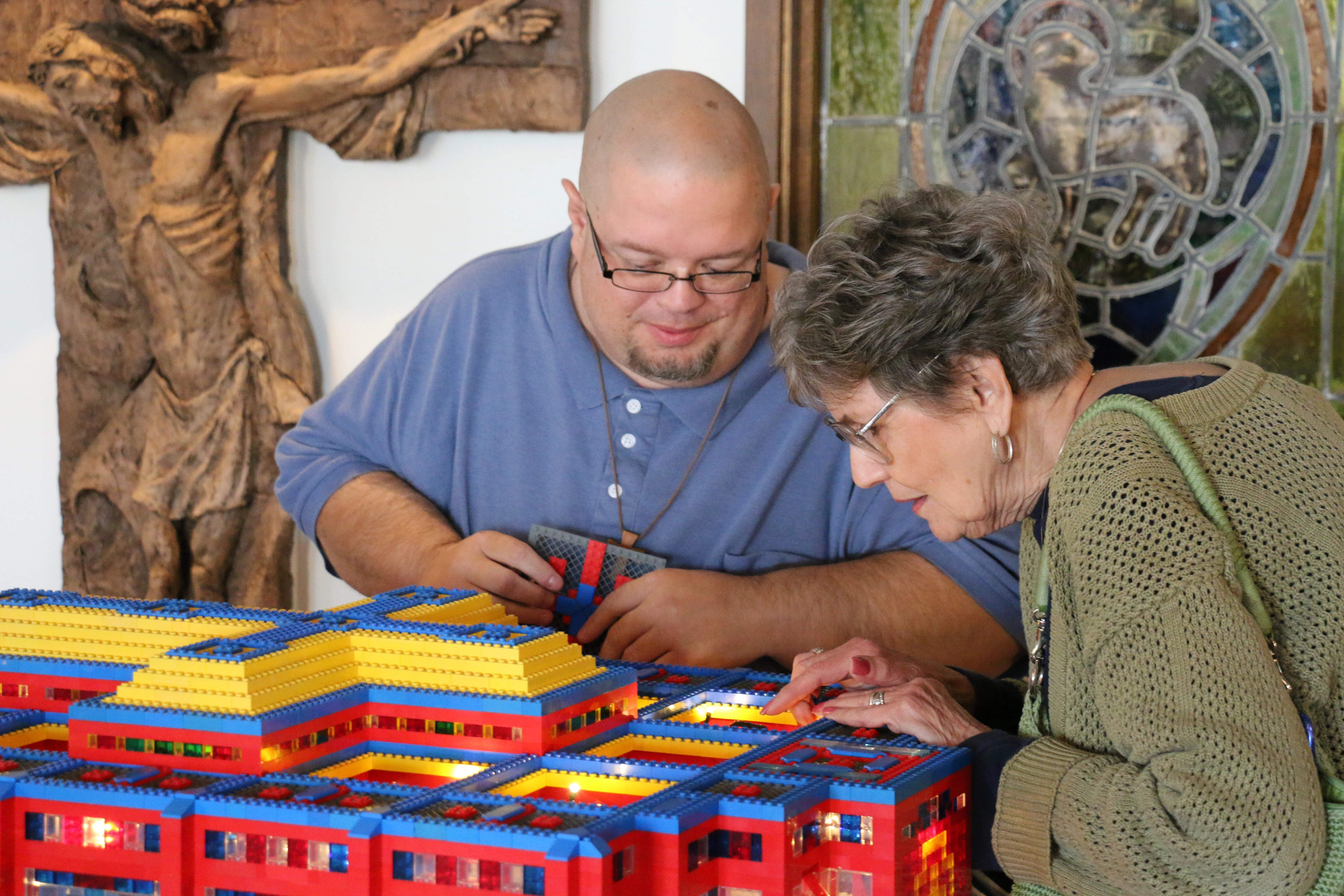 John Kraemer shows off the interior of one of his Lego churches to an interested parishioner at Resurrection of the Lord Parish in Standish, Michigan.?w=200&h=150