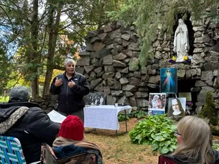 Patrick Norton tells his incredible story of meeting who he believes was Sister Annella Zervas at Our Lady of Lourdes Grotto in the Saint Benedict Monastery cemetery in St. Joseph, Minnesota. Around 150 people gathered for an event where a letter was read from the bishop about steps being taken to look into opening a cause for Zervas. Oct. 15, 2023.?w=200&h=150