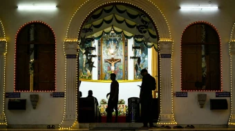 People visit the St. Patrick Catholic Church, illuminated with decorative lights on Christmas Eve in Chennai, Tamil Nadu, India, on Dec. 24, 2024.