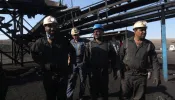 Iranian miners look on at the scene of a blast at a coal mine in Tabas in Iran’s Khorasan province on Sept. 22, 2024. The blast caused by a gas leak at the coal mine in eastern Iran has killed at least 50 people, state media said Sept. 22, in one of Iran’s deadliest work accidents in years.