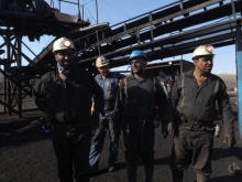 Iranian miners look on at the scene of a blast at a coal mine in Tabas in Iran’s Khorasan province on Sept. 22, 2024. The blast caused by a gas leak at the coal mine in eastern Iran has killed at least 50 people, state media said Sept. 22, in one of Iran’s deadliest work accidents in years.