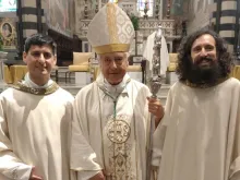 Bearded former punk band guitarist Father Giulio Vannucci and former policeman Father Michele Di Stefano flank Bishop Giovanni Nerbini following their June 8, 2024, ordination to the Catholic priesthood.