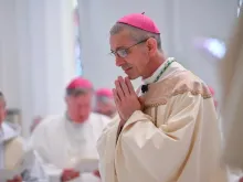 Bishop James Ruggieri prays during his ordination Mass in Portland, Maine on May 7, 2024.