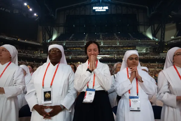 Religious sisters pray at the closing Mass of the National Eucharistic Congress on July 21, 2024. Credit: Jeffrey Bruno