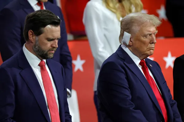 Republican vice presidential candidate J.D. Vance and former president Donald Trump bow in prayer during the last day of the 2024 Republican National Convention at the Fiserv Forum in Milwaukee on July 18, 2024. Credit: KAMIL KRZACZYNSKI/AFP via Getty Images